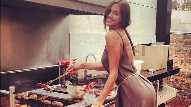 Irina is beautiful even doing a barbecue. 