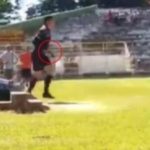 A referee is attacked and pulls a gun on half of the match