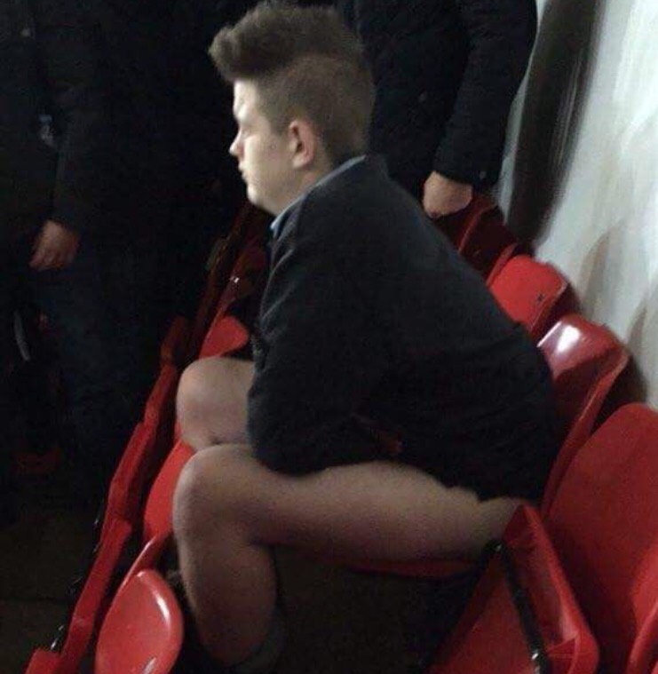A fan of Sunderland is set to shitting in the stands in the middle of a match